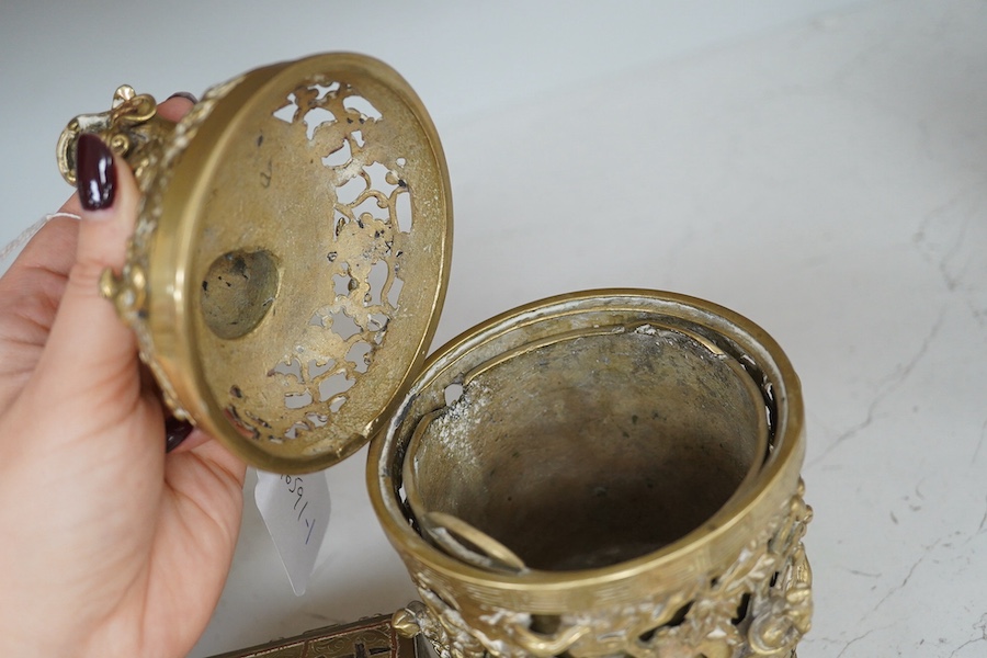 A pair of inscribed Chinese polished bronze reticulated censers, liners and covers, late 19th century, 20cm high together with a Cairo ware box, Condition - fair to good.